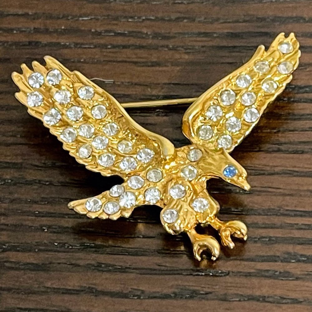 Eagle brooch with golden metal and rhinestones